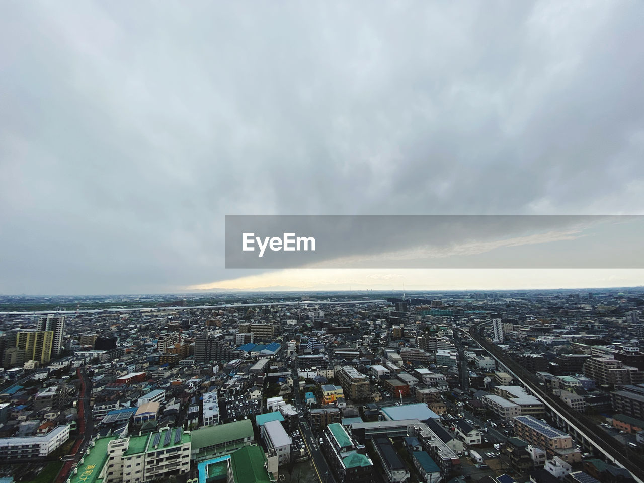 HIGH ANGLE VIEW OF CITY AGAINST SKY