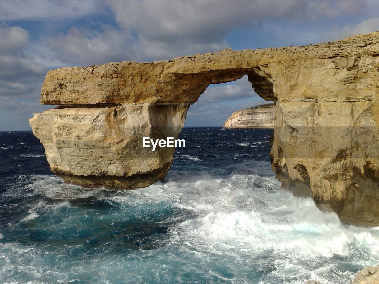 Azure window at gozo island against sky