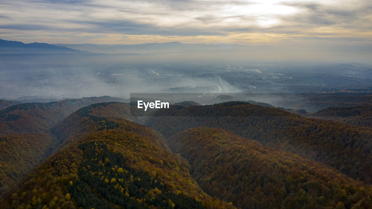 SCENIC VIEW OF LAND AGAINST SKY DURING SUNSET