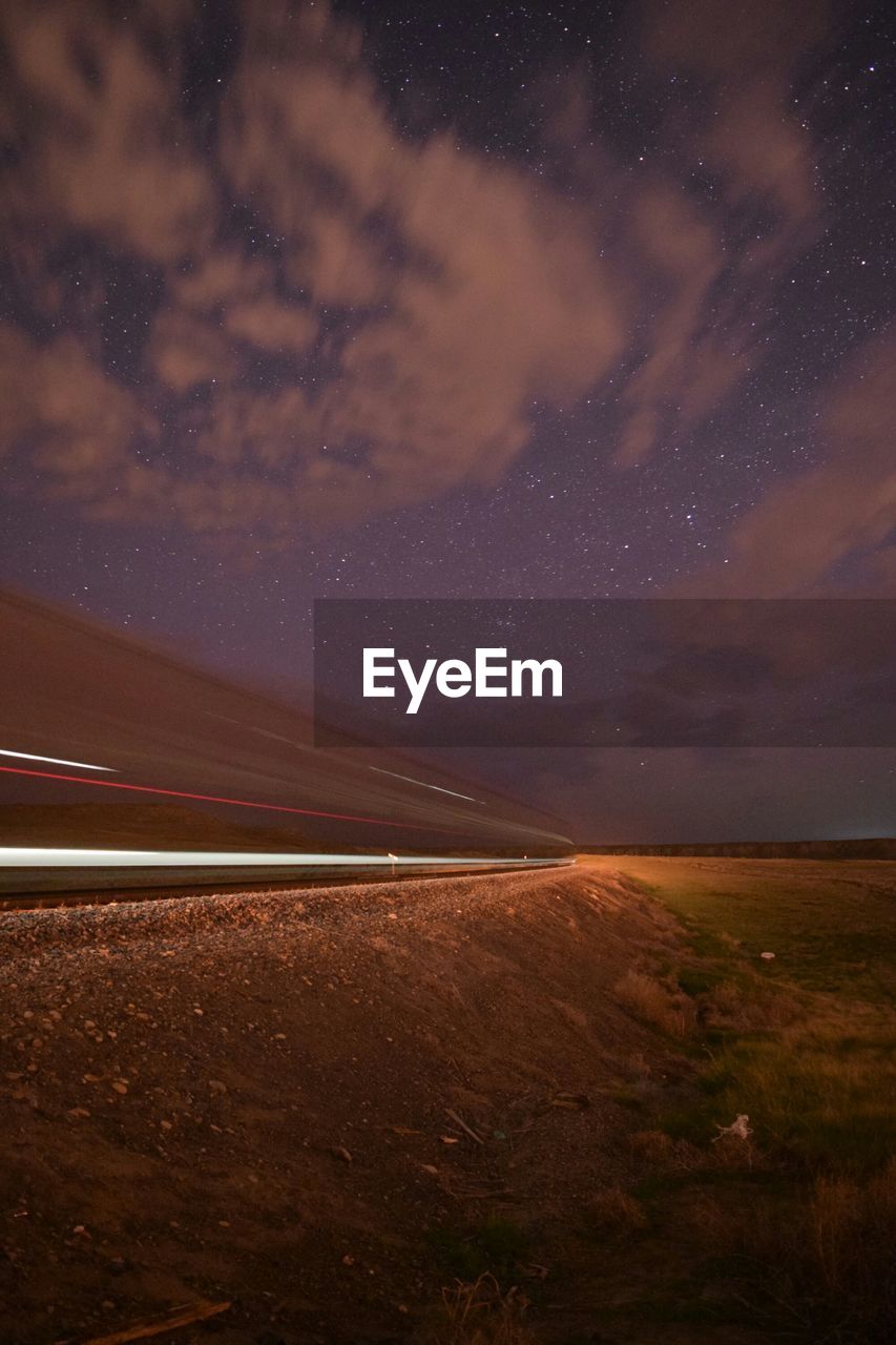 Scenic view of landscape against sky at night