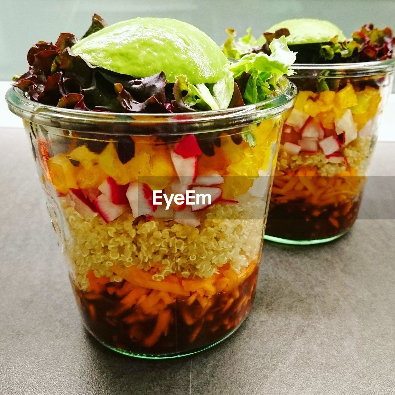 Close-up of food in drinking glasses on table