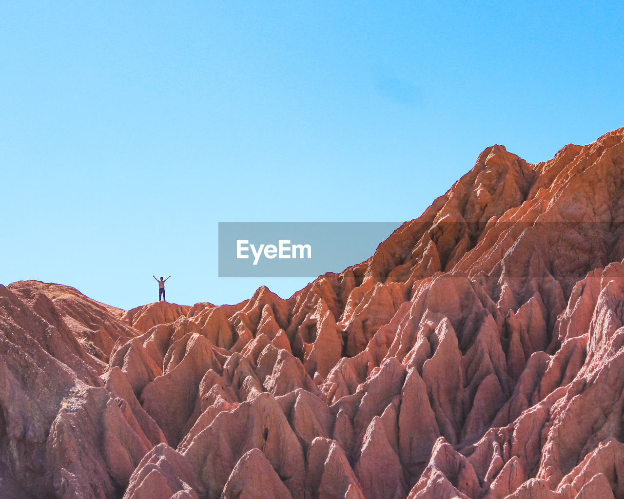 Scenic view of mountains against clear blue sky