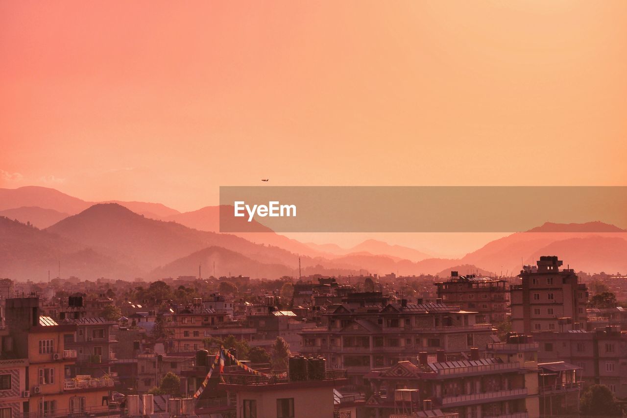 High angle view of townscape against sky during sunset