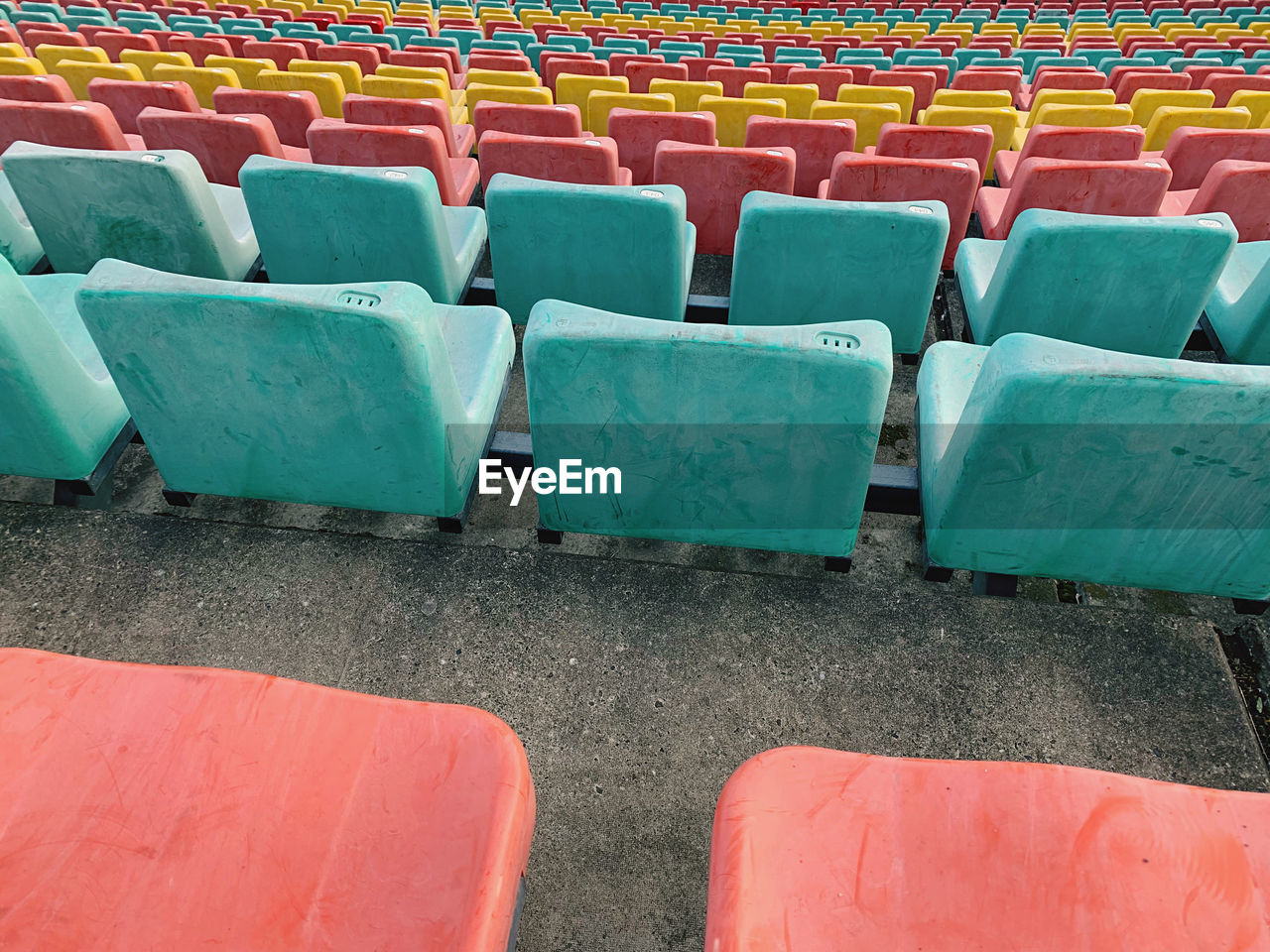 HIGH ANGLE VIEW OF EMPTY CHAIRS AT STADIUM