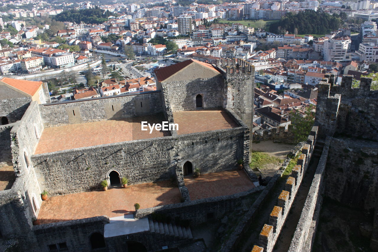 High angle view of historic castle by cityscape