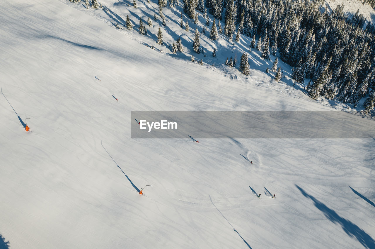 Aerial image of people skiing on piste, zell am see, austria