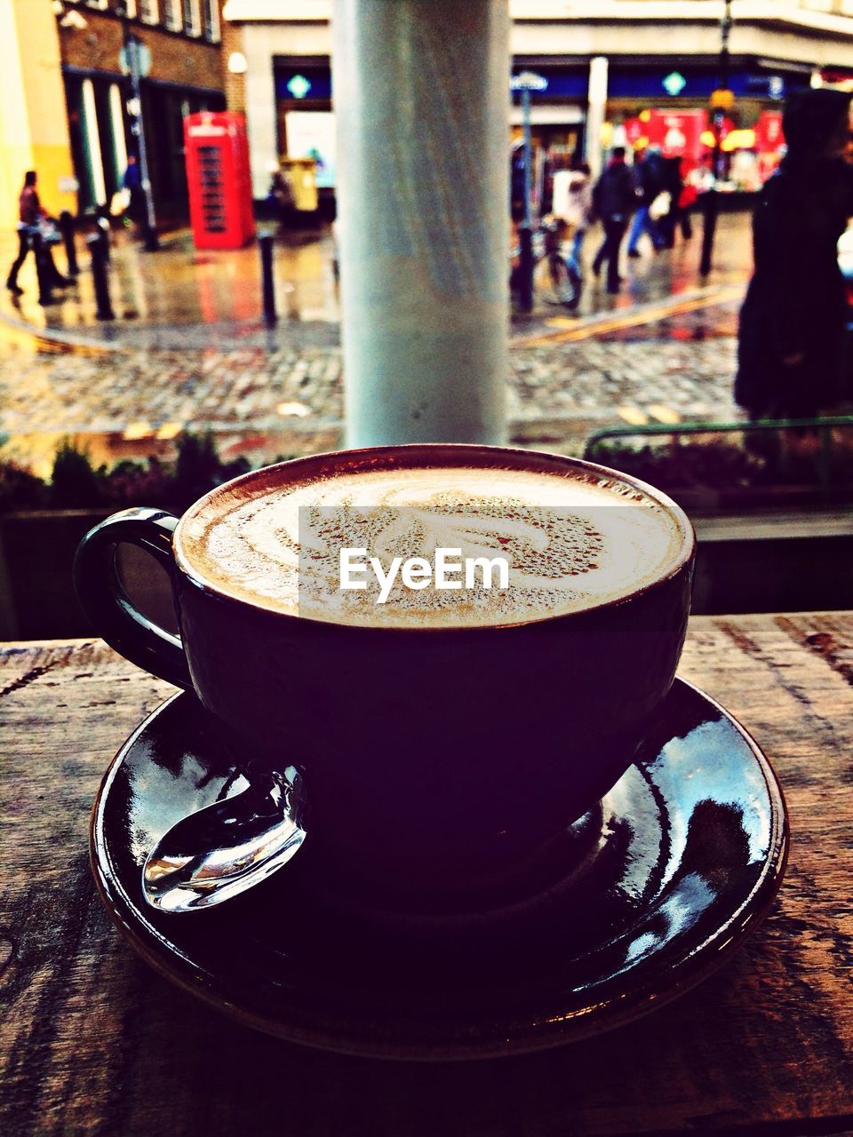 Close-up of cappuccino served on table in cafe