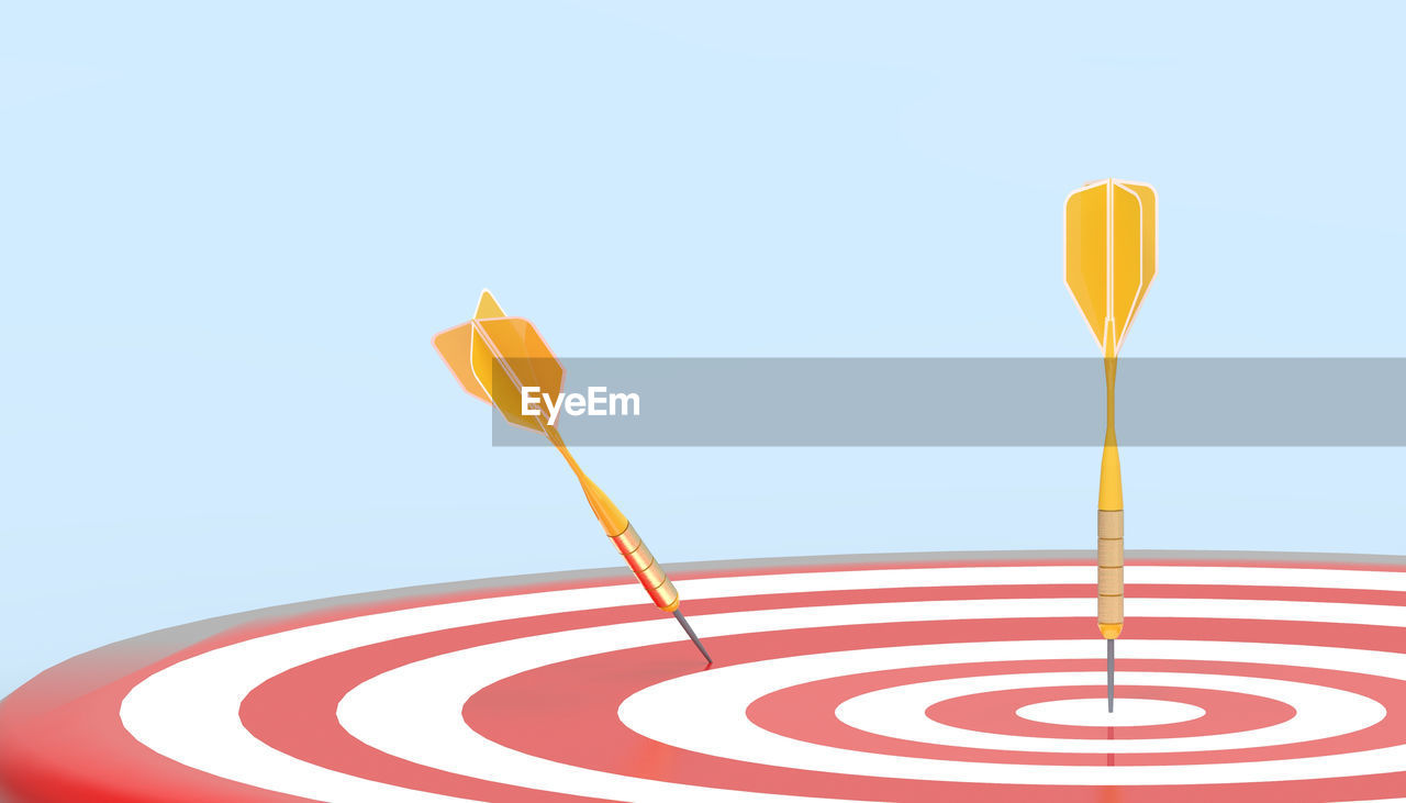 Tactics of targeting winner. target board success with yellow arrows and business concept on blue 