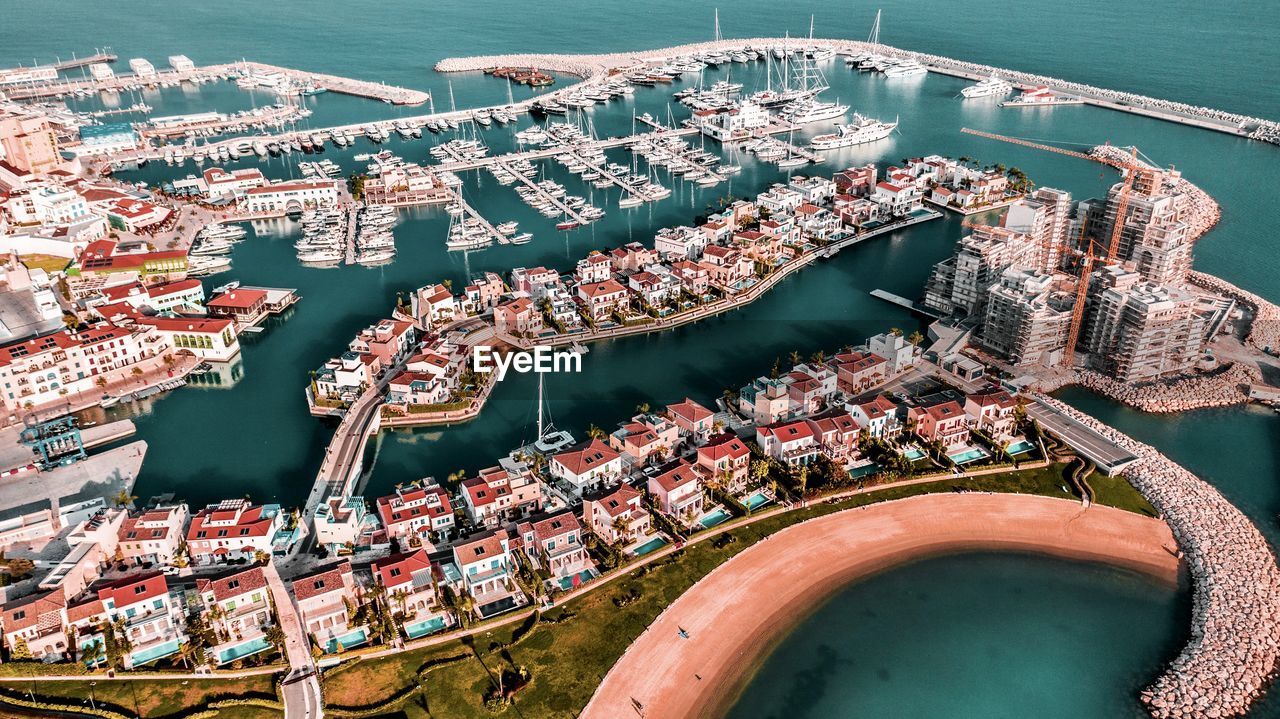 High angle view of river amidst buildings