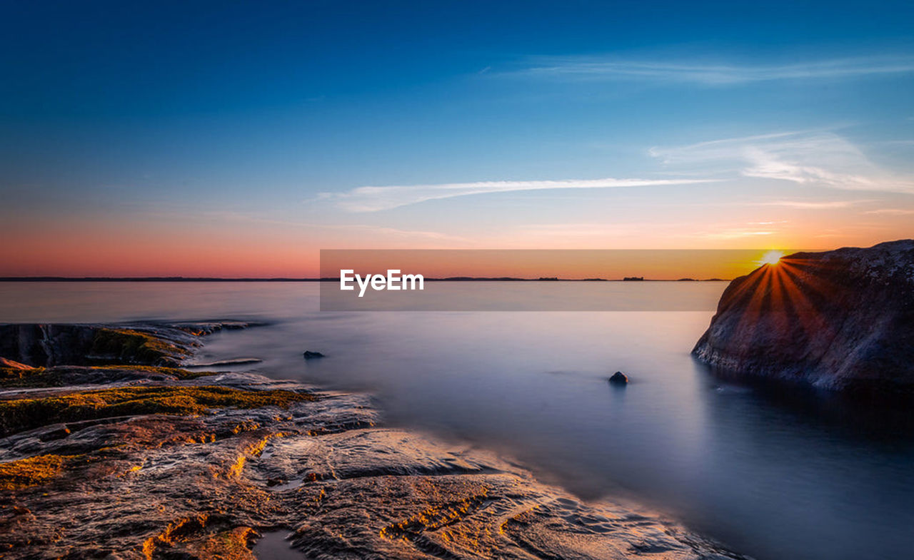 Scenic view of sea against sky during sunset