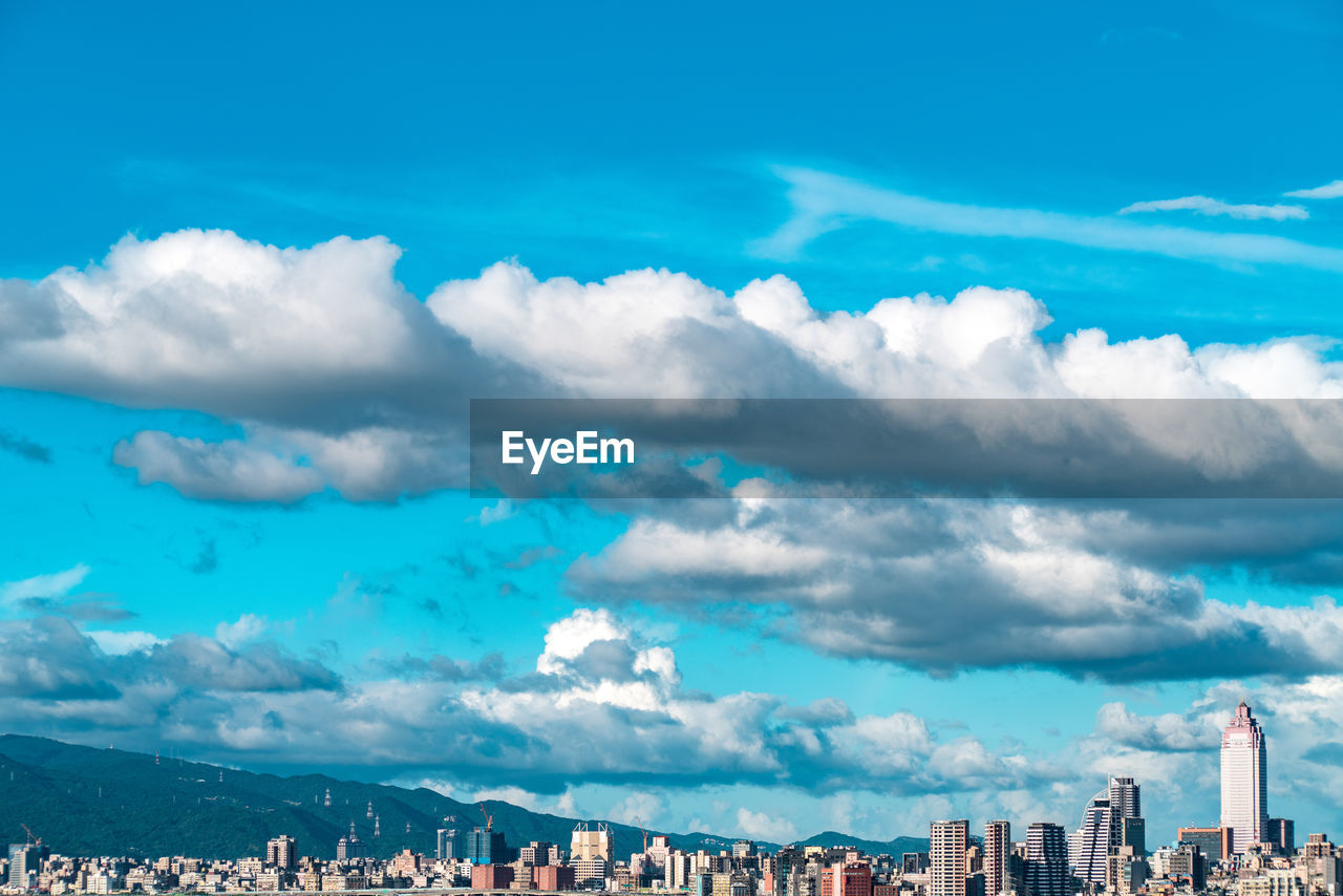 PANORAMIC SHOT OF BUILDINGS AGAINST SKY