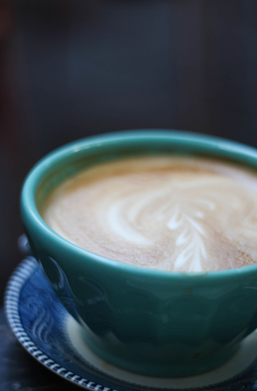 High angle view of coffee served on table