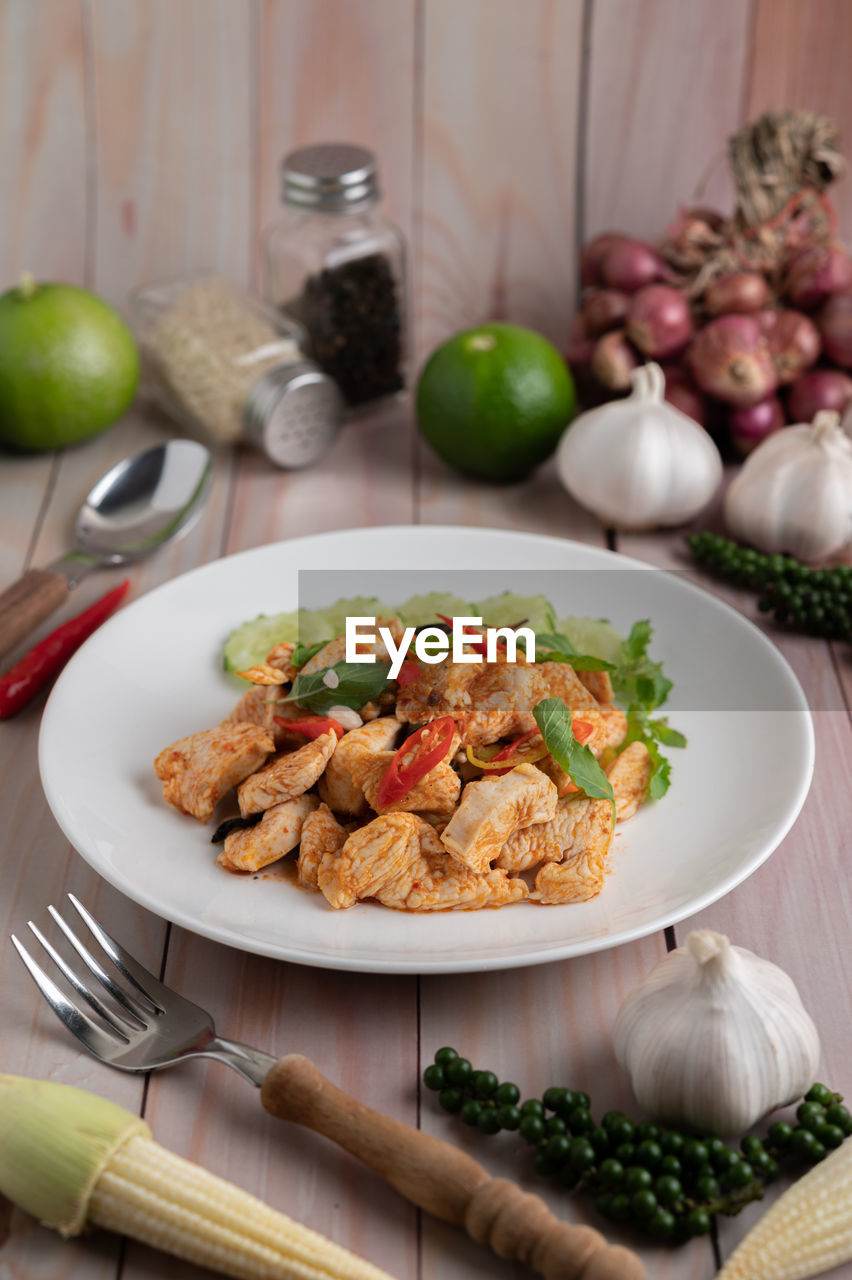 FOOD SERVED IN PLATE ON TABLE