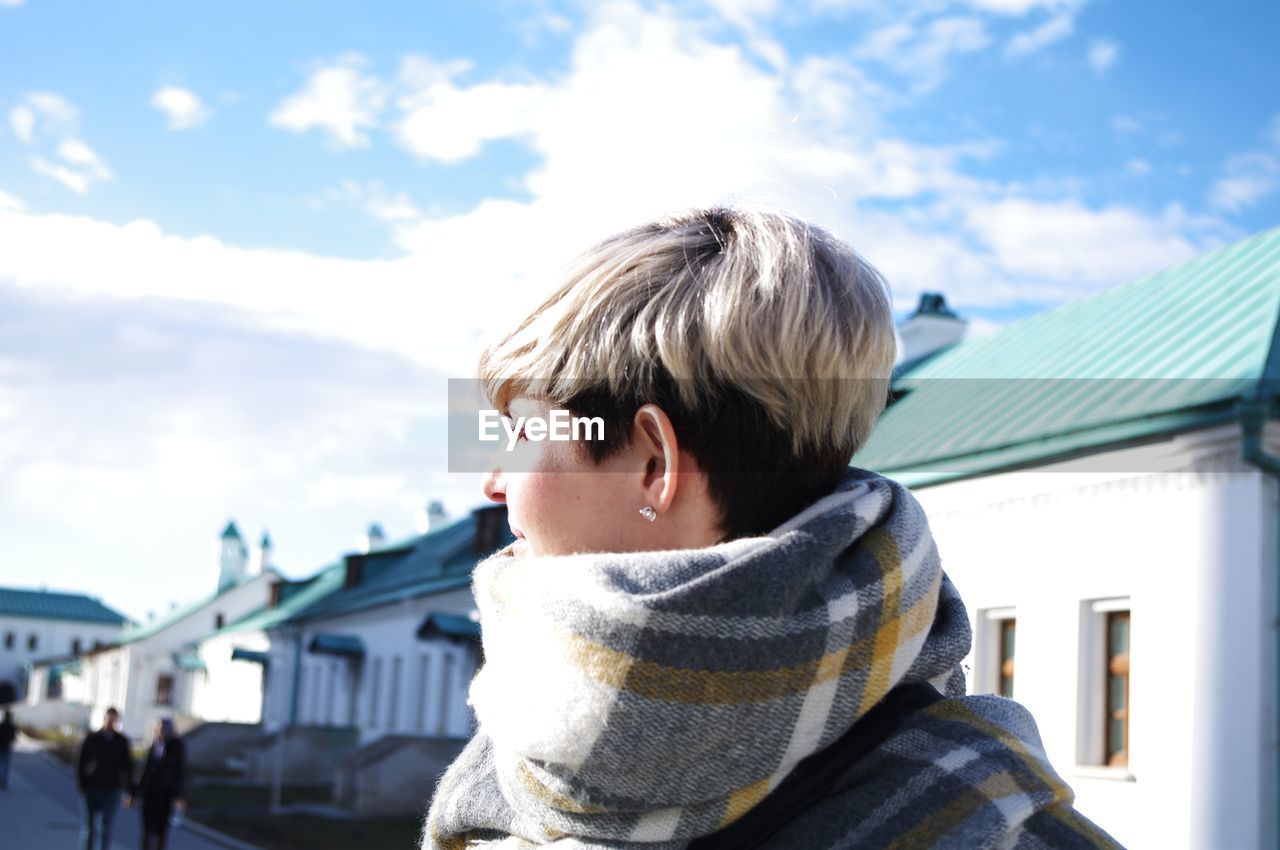 Portrait of young man against sky