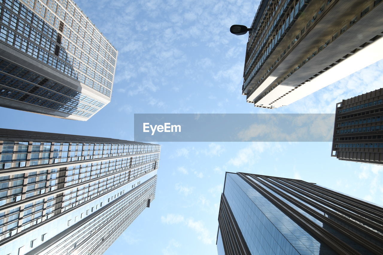 Low angle view of modern buildings against sky