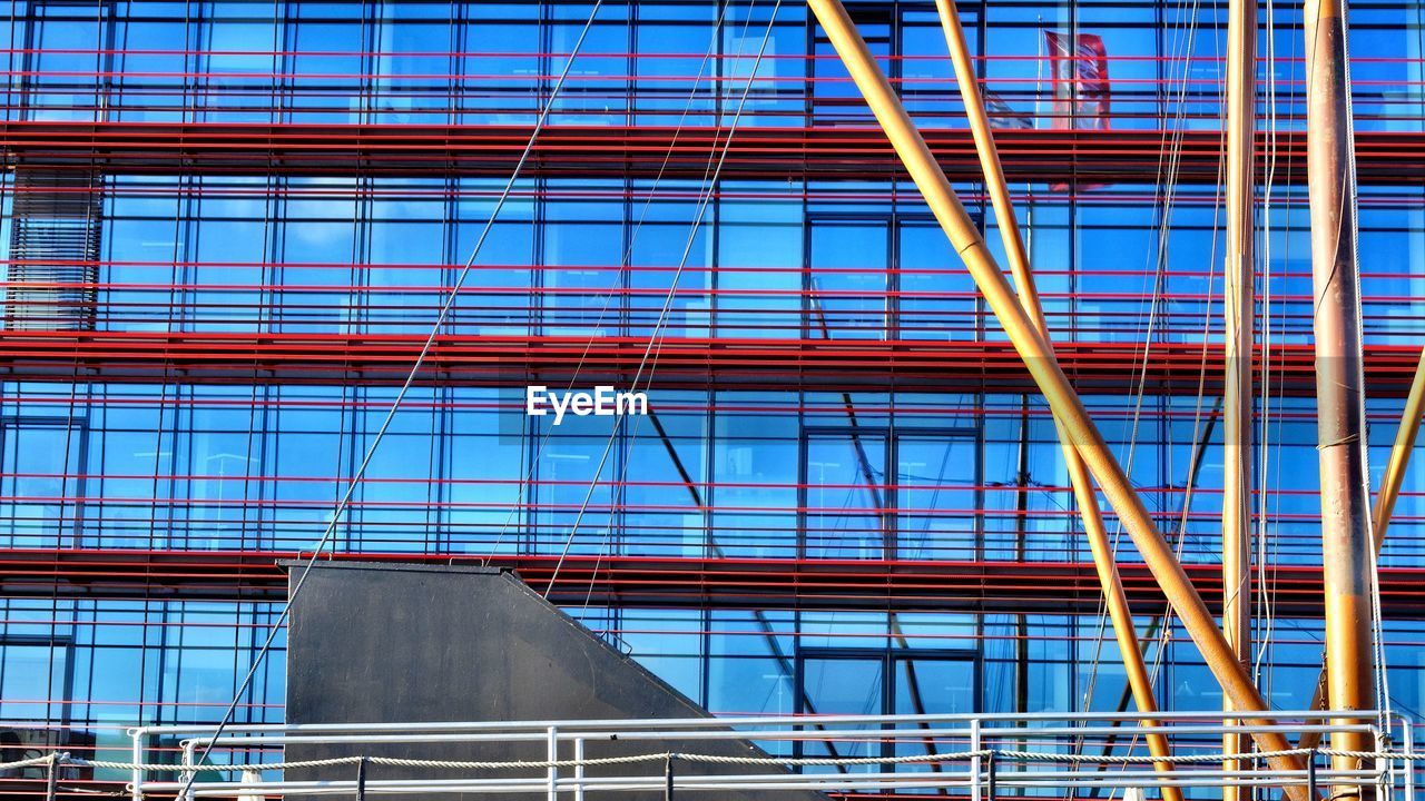 Masts of a boat in front of coca-cola hq in berlin