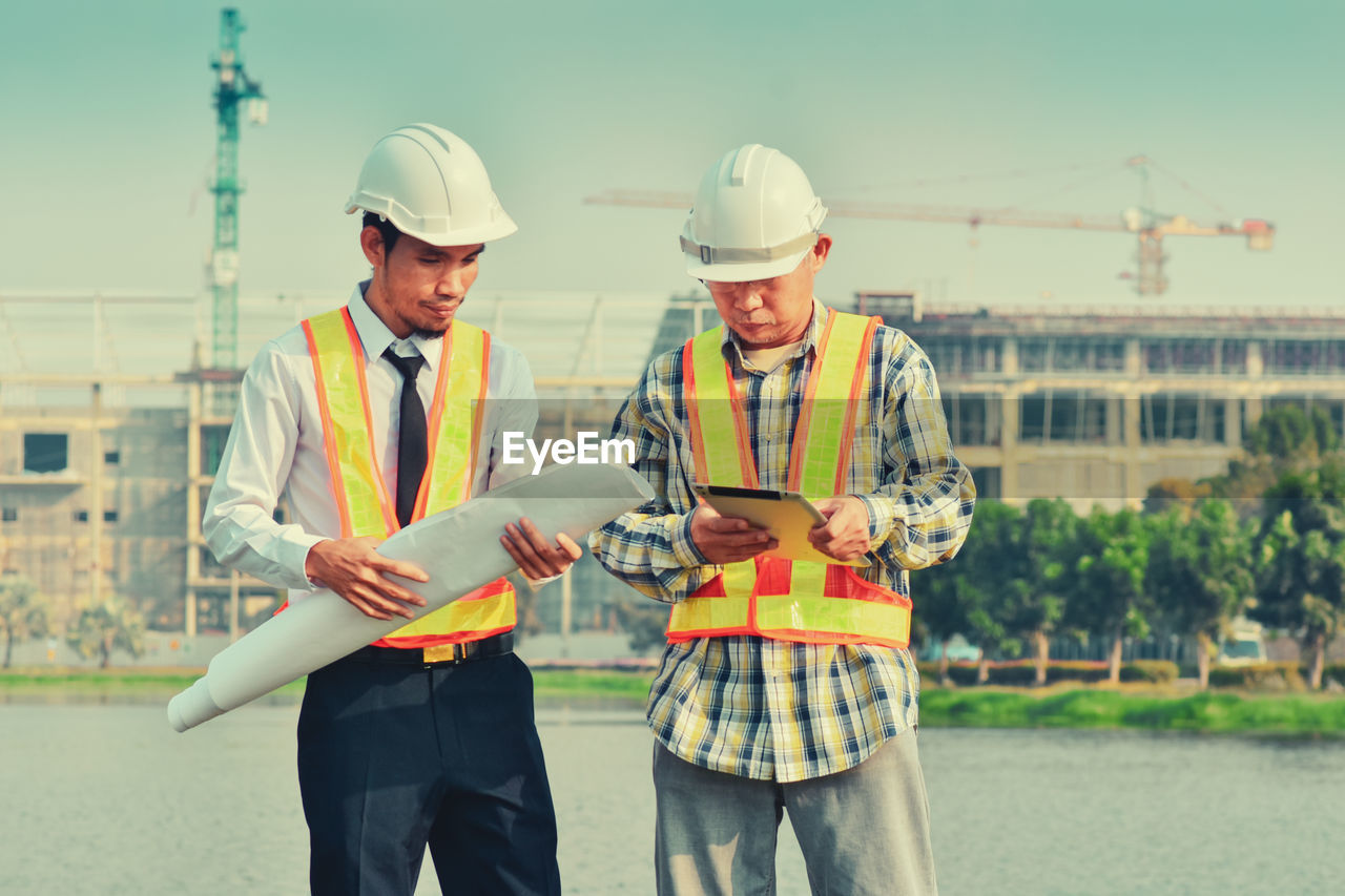 MEN WORKING AT CONSTRUCTION SITE IN PARK