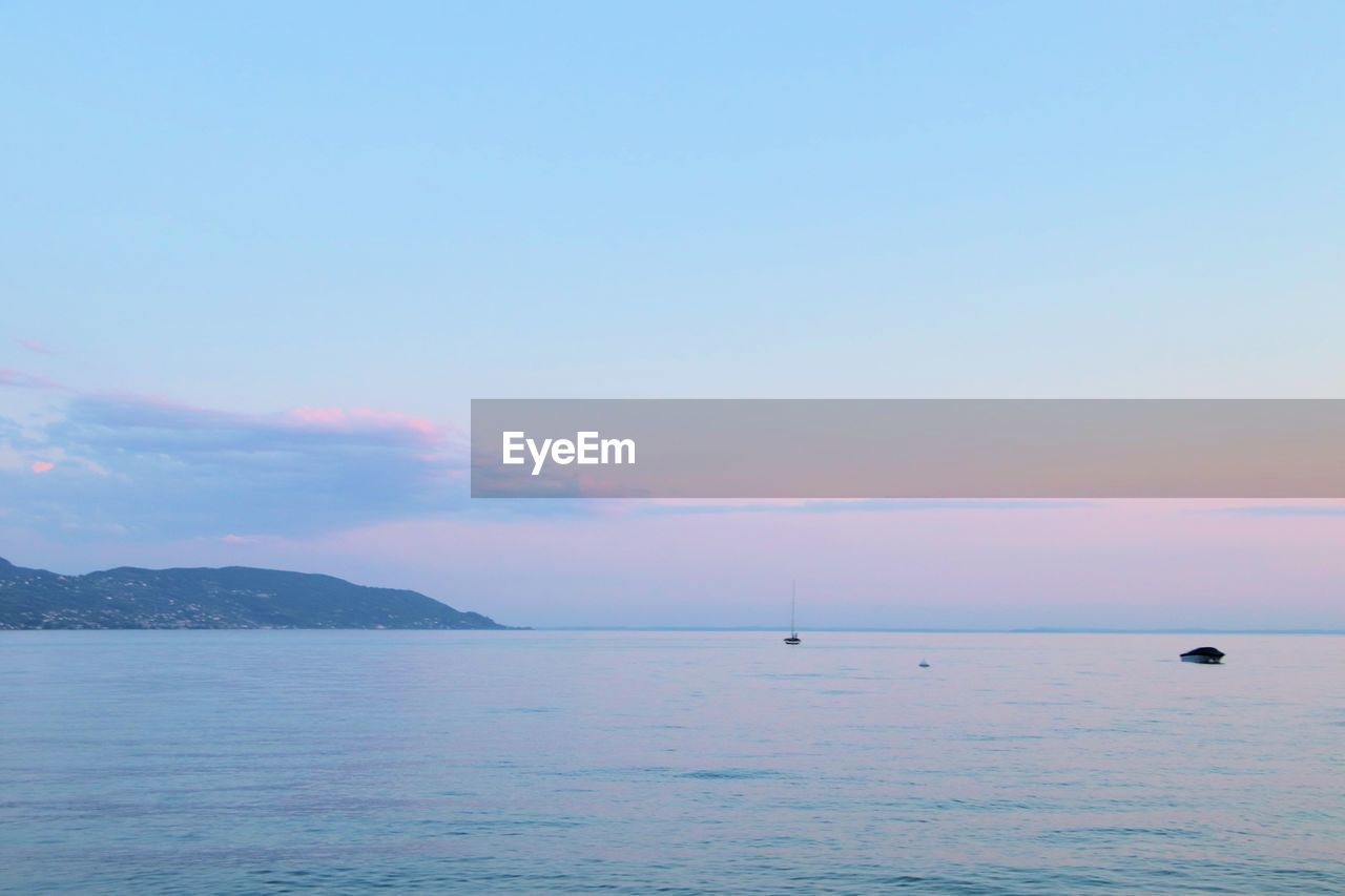 SCENIC VIEW OF SEA AGAINST BLUE SKY