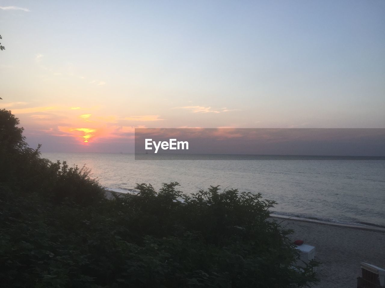 Scenic view of sea at sunset