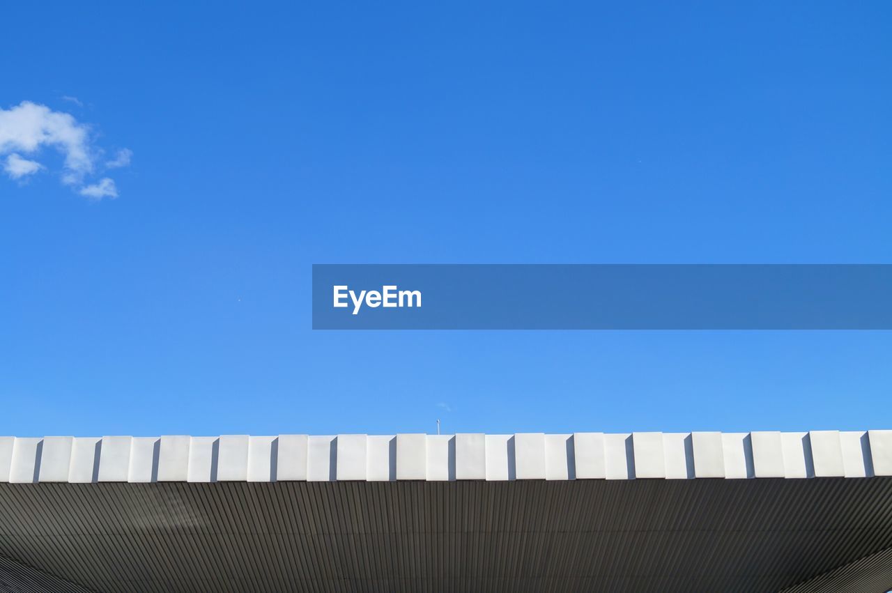 Low angle view of modern roof against sky
