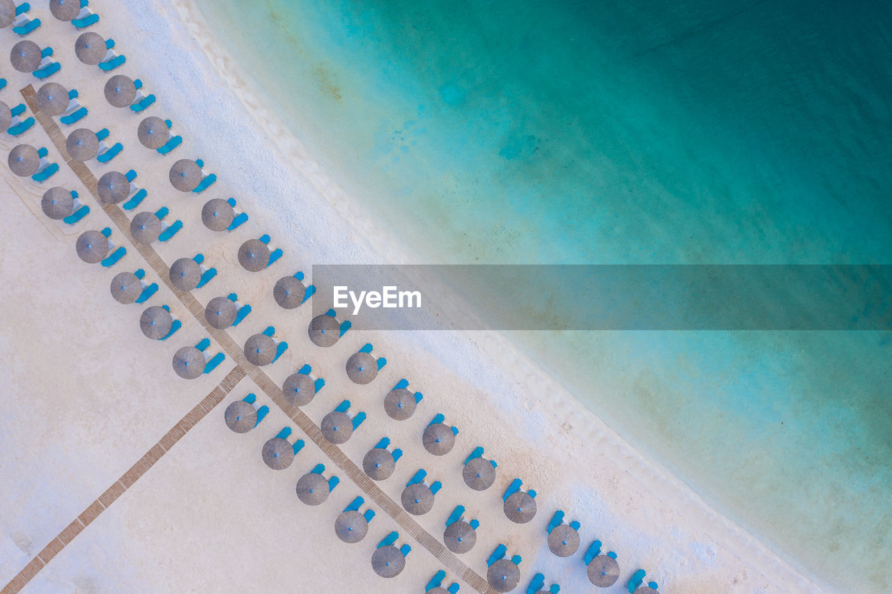 Drone point of view of parasols at beach