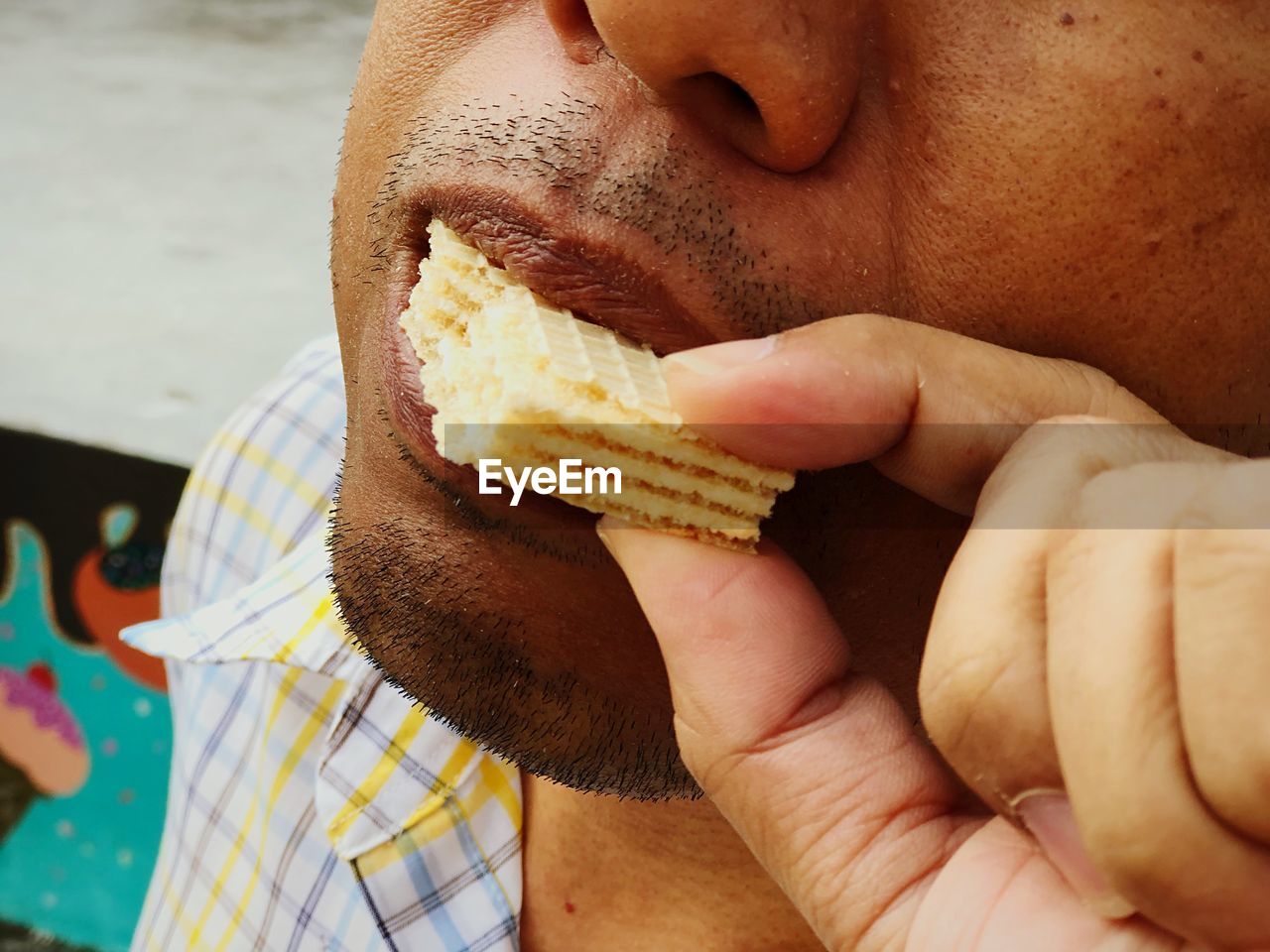 Close-up of man eating food