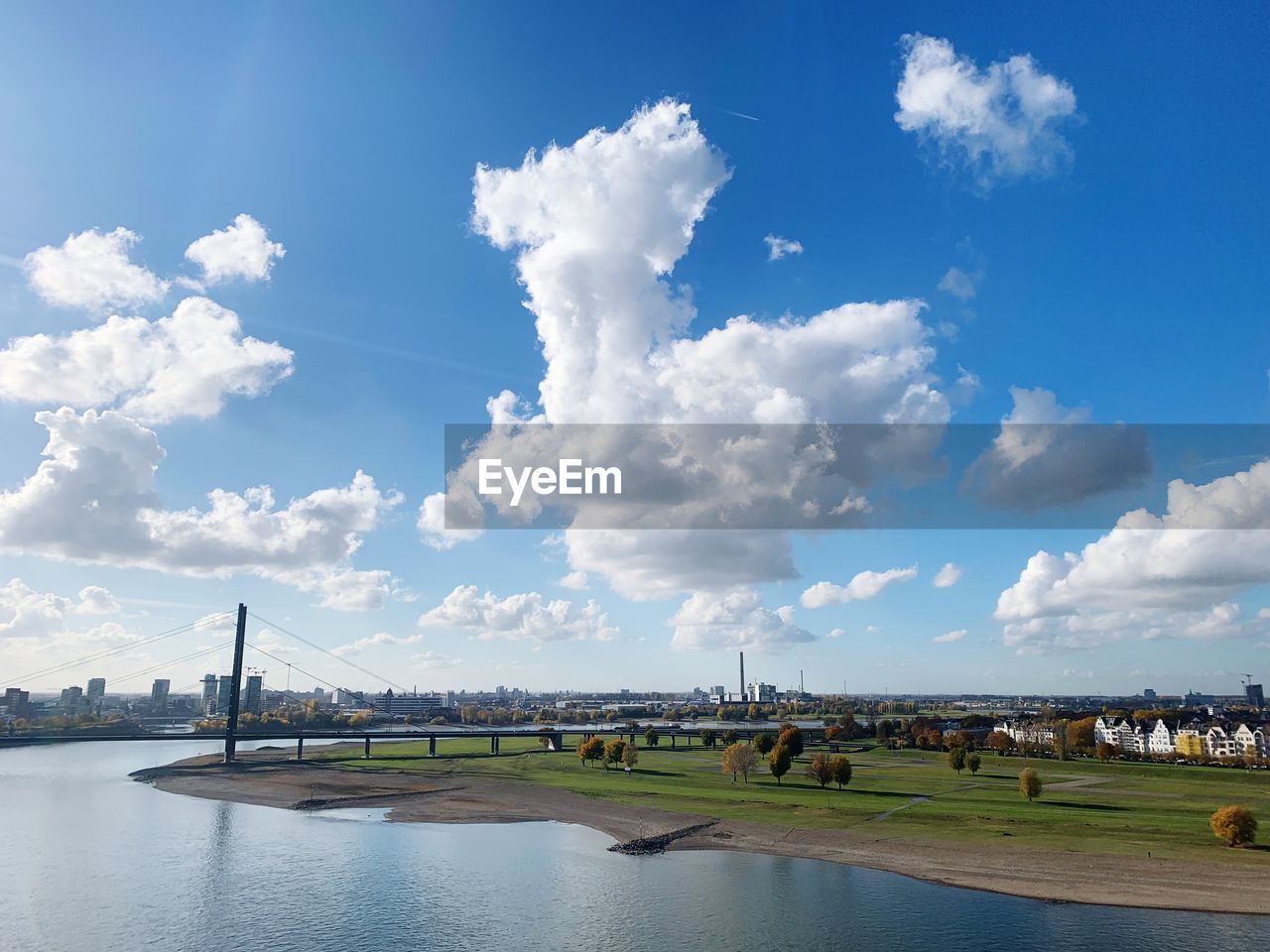 View of bridge over river against cloudy sky