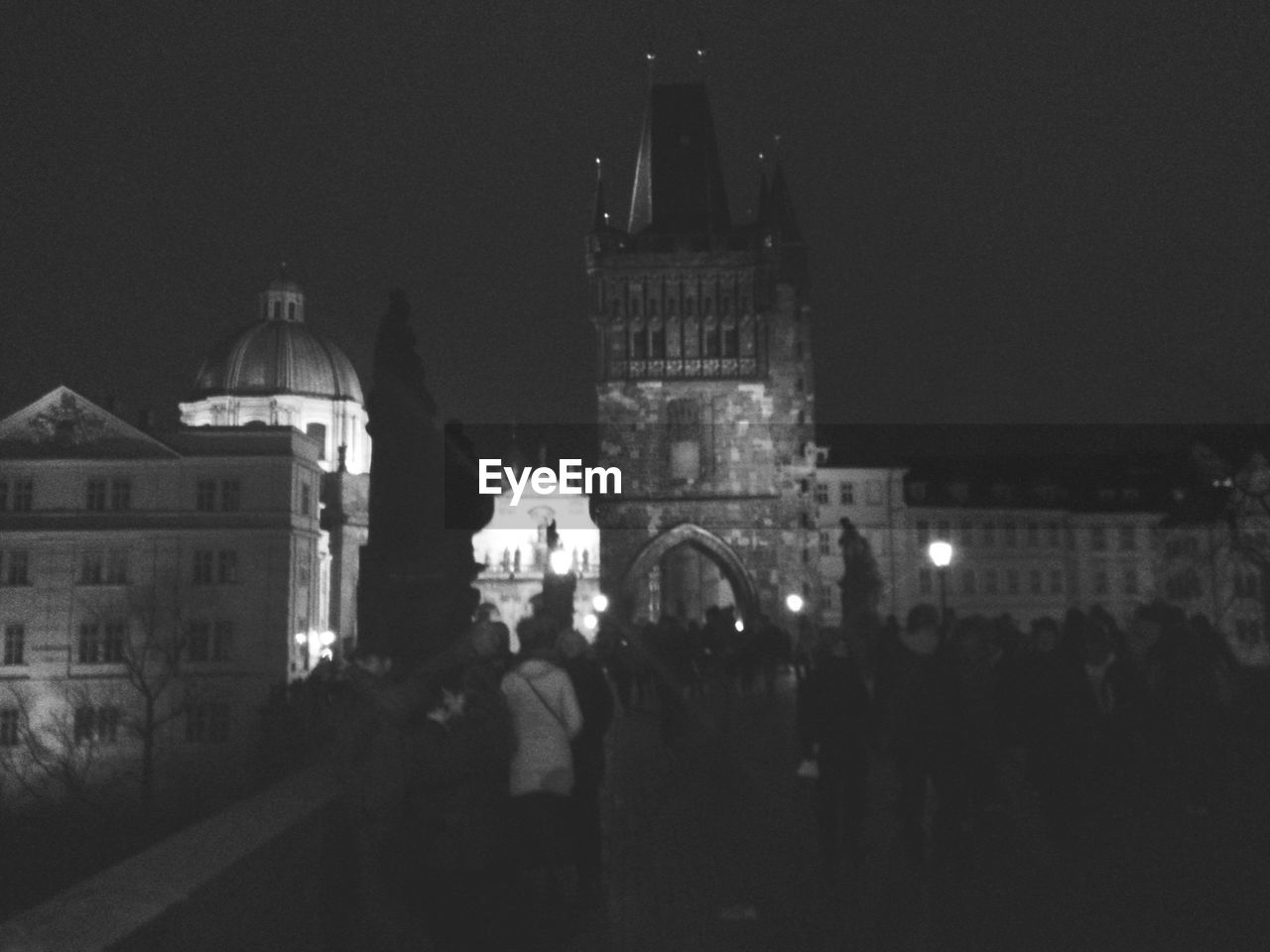 VIEW OF ILLUMINATED CITY AT NIGHT