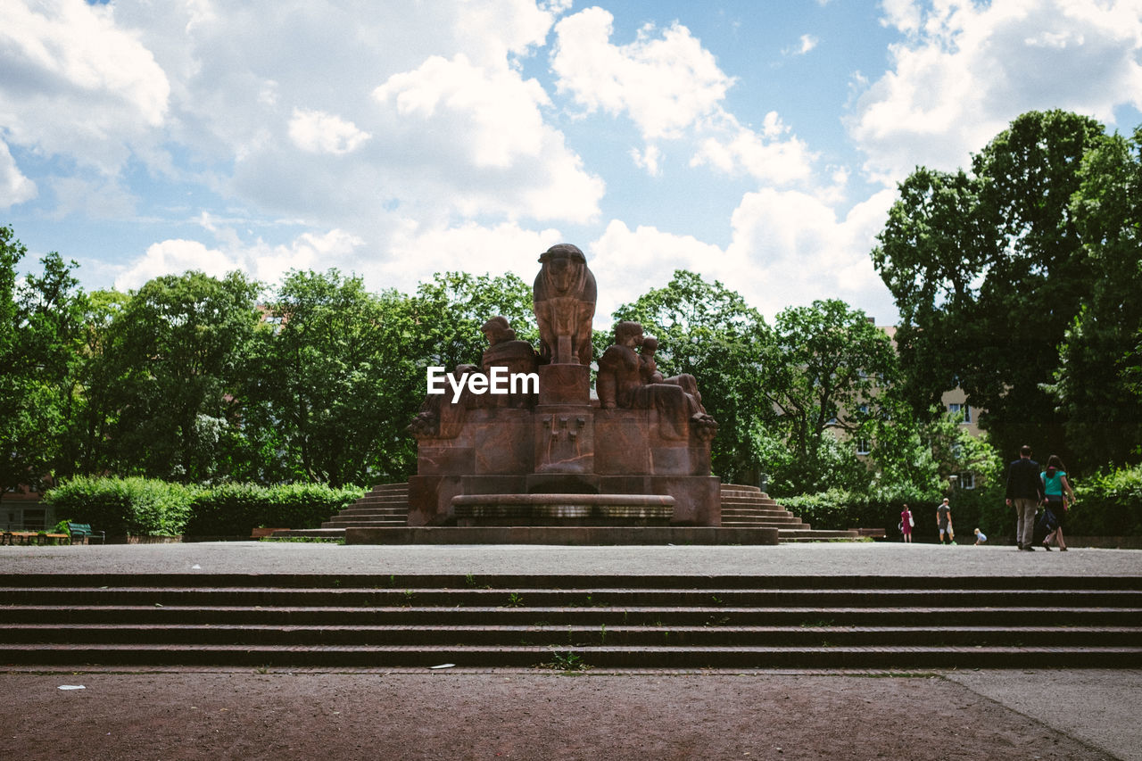 Statue in temple against sky