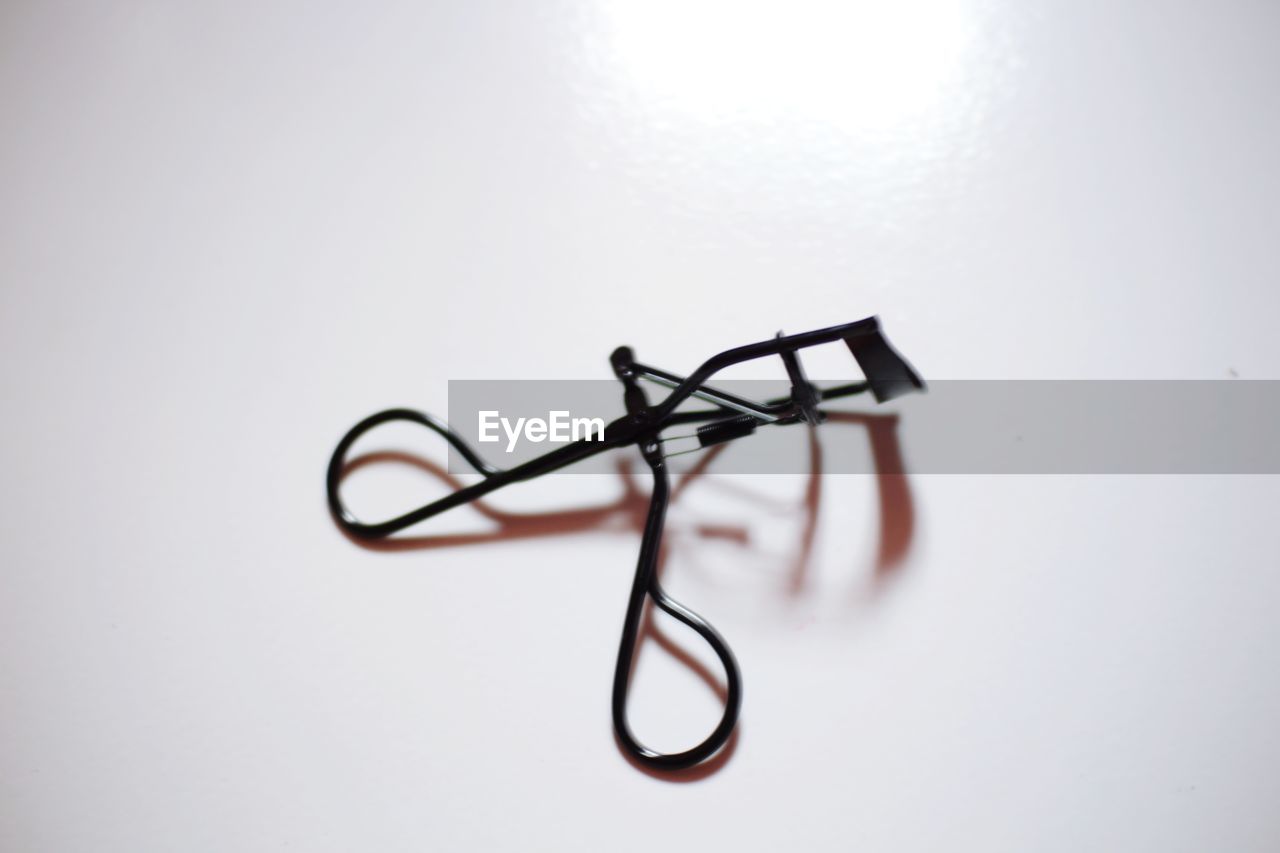 CLOSE-UP OF EYEGLASSES ON TABLE