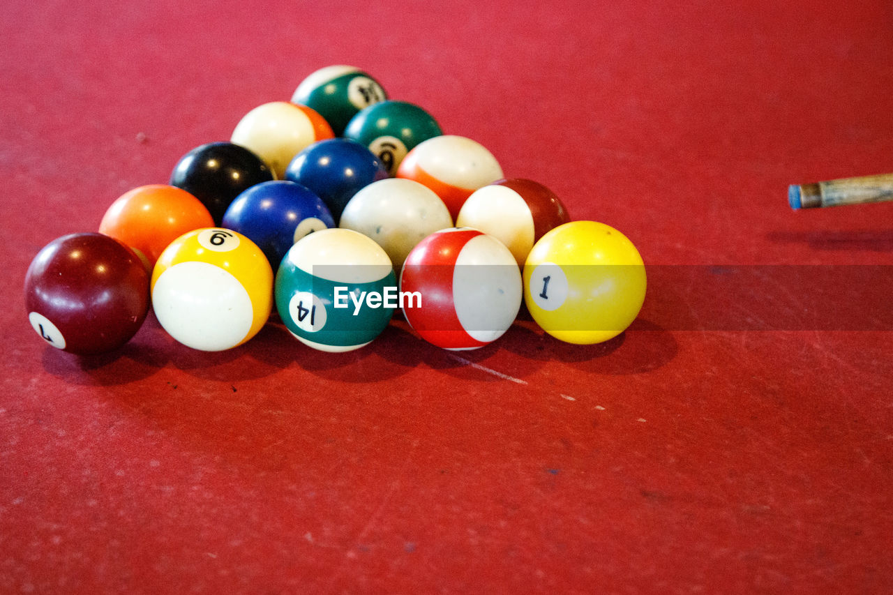 pool ball, billiards, table, ball, sports, pool table, pool sport, billiard ball, billiard table, multi colored, indoor games and sports, indoors, red, number, no people, still life, leisure activity, nine-ball, relaxation, eight-ball, leisure games, cue stick, game, sphere, sports equipment, close-up, large group of objects, high angle view, arrangement