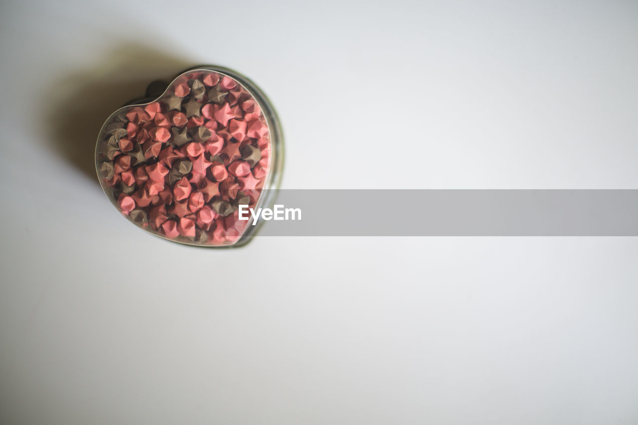 Directly above shot of breakfast cereal in heart shape container on table