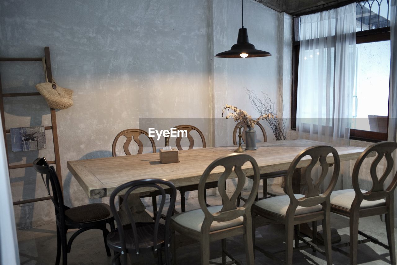 Empty chairs and table in restaurant