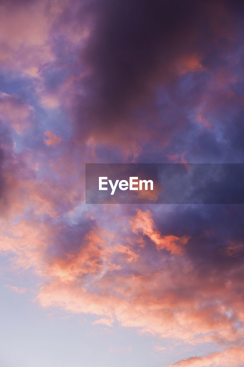 Low angle view of cloudy sky during sunset