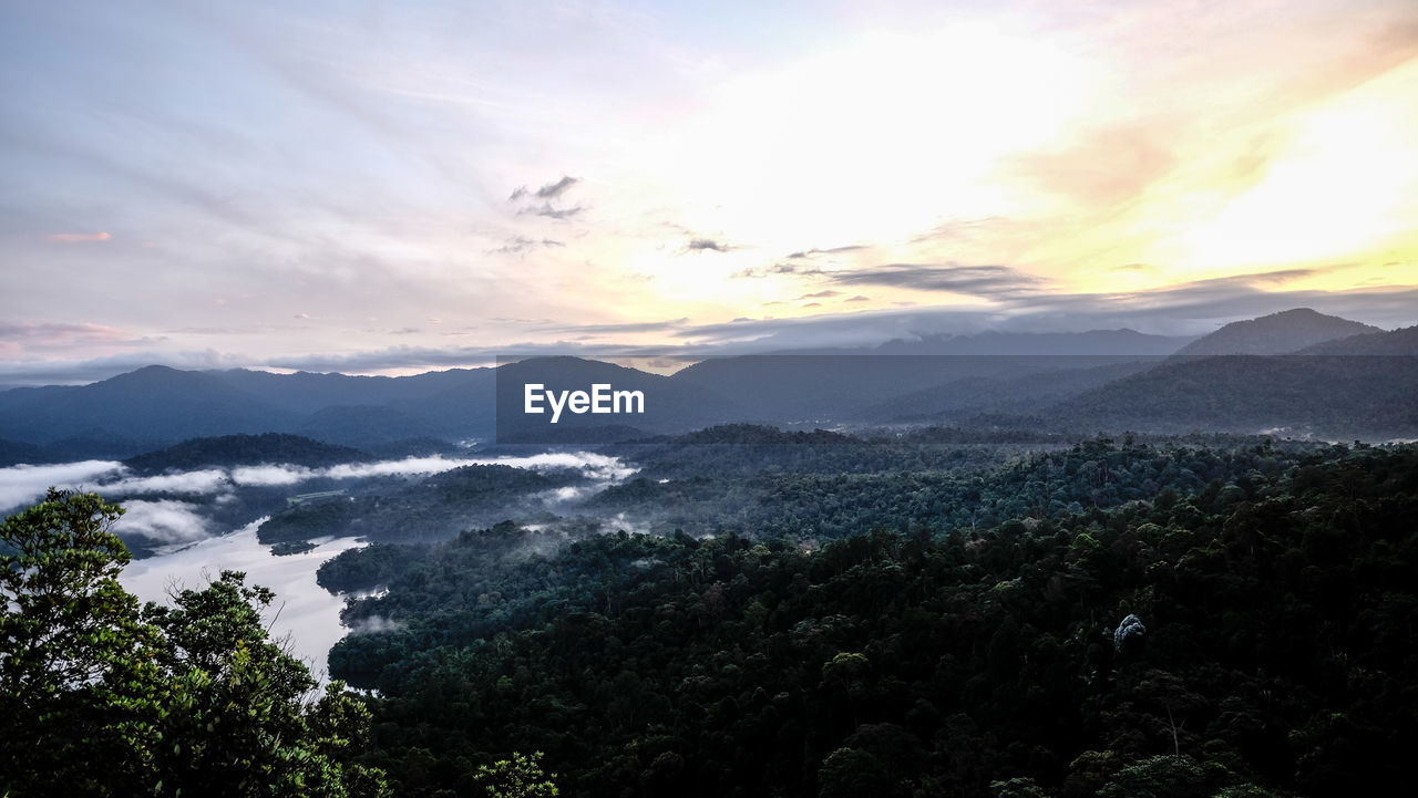 SCENIC VIEW OF MOUNTAIN RANGE AGAINST SKY DURING SUNSET