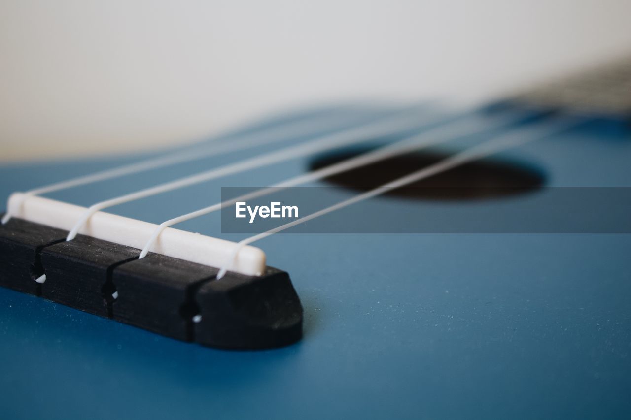 Close-up of guitar on table