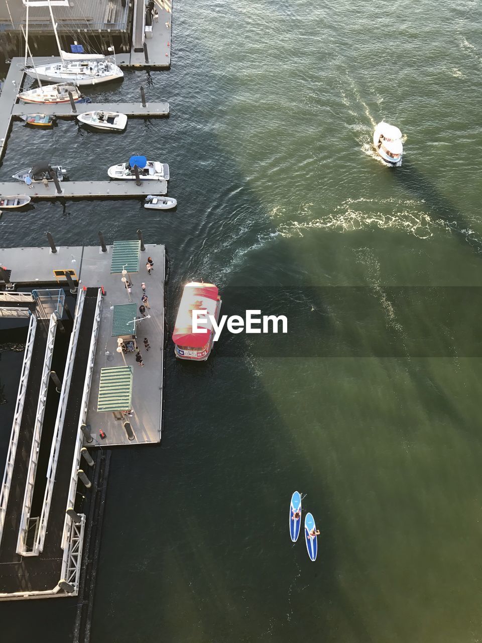 HIGH ANGLE VIEW OF NAUTICAL VESSELS MOORED ON RIVER