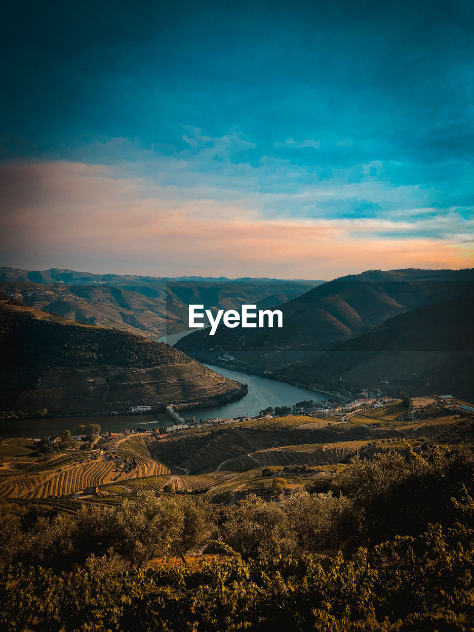 Scenic view of landscape against sky during sunset