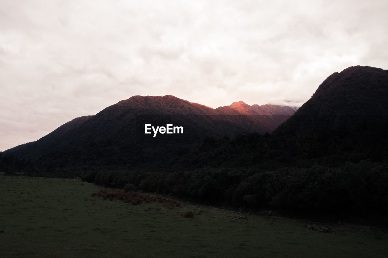 Scenic view of mountains against sky during sunset