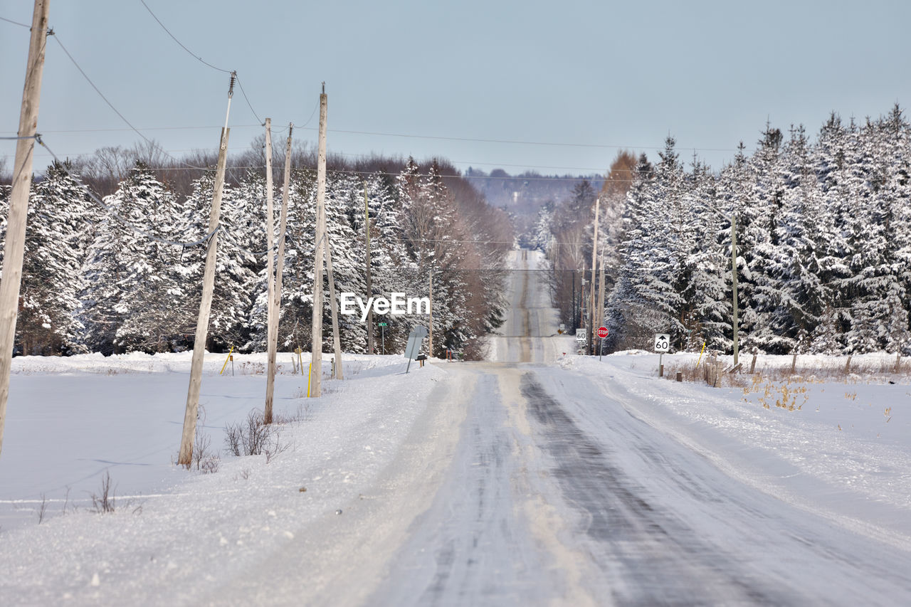 Snow covered road in rural ontario canada 