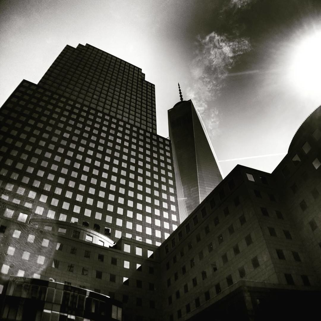 LOW ANGLE VIEW OF MODERN BUILDINGS AGAINST SKY