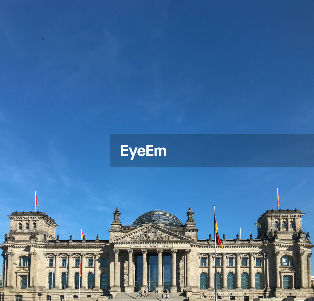 Low angle view of reichstag building against blue sky