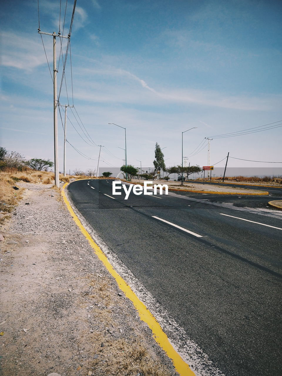 Empty road against sky