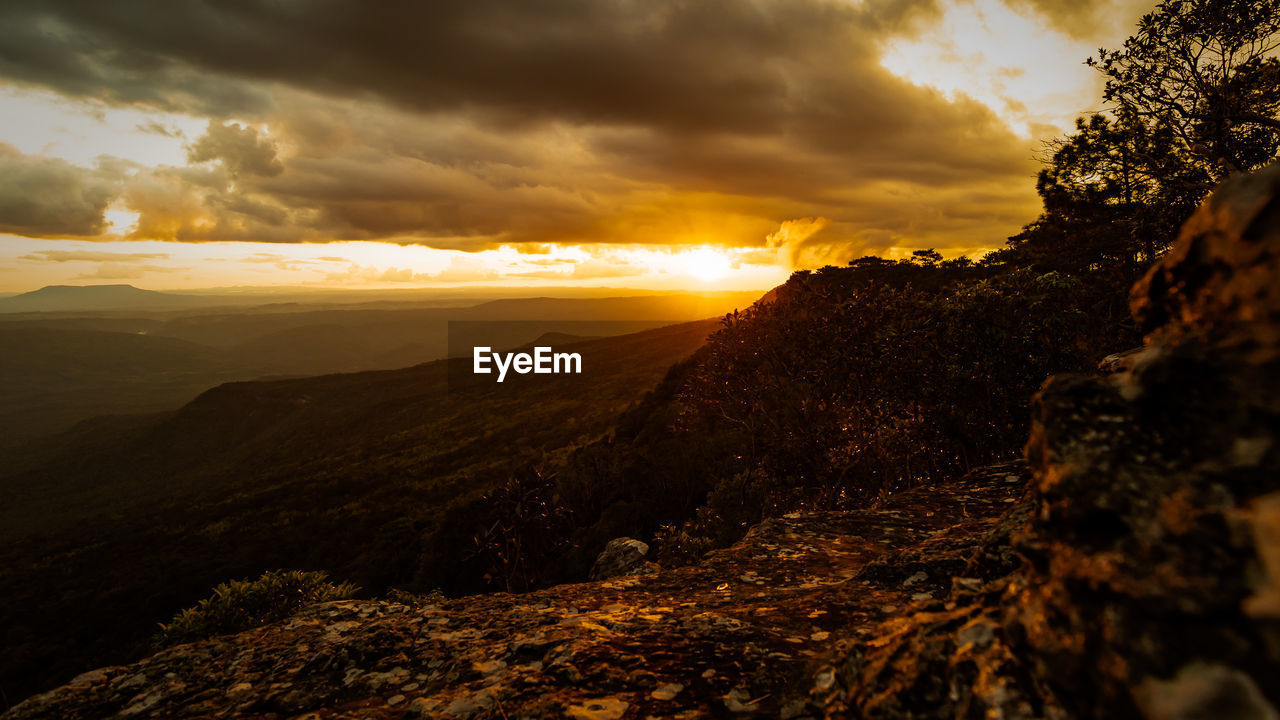 SCENIC VIEW OF MOUNTAINS DURING SUNSET