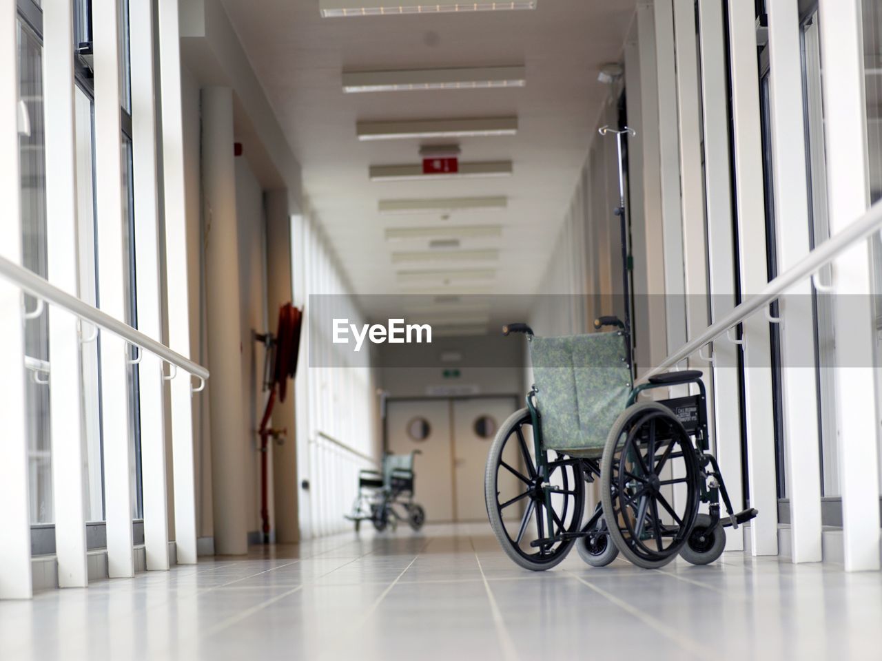 Wheelchair on empty hospital corridor