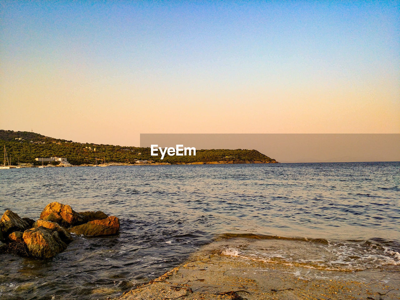 SCENIC VIEW OF BEACH AGAINST CLEAR SKY