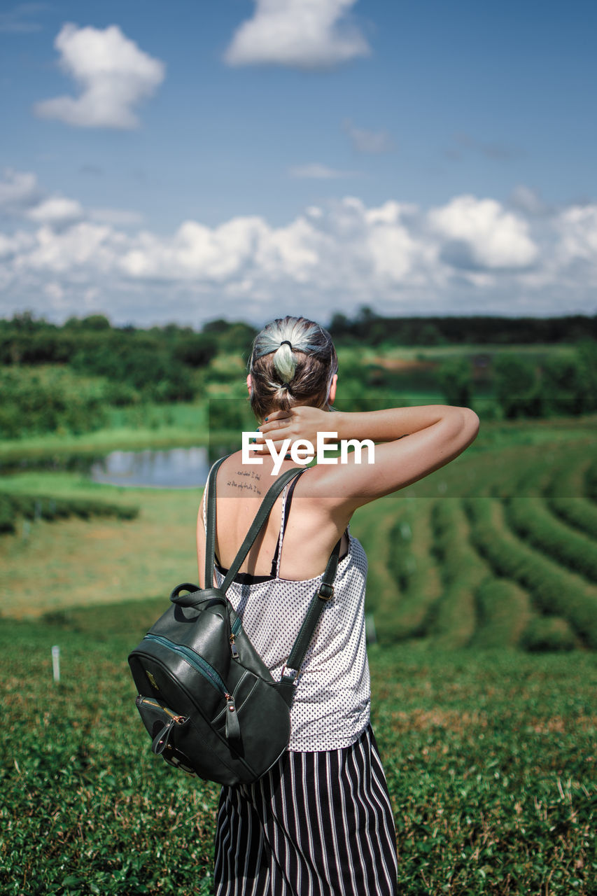 Woman standing on field