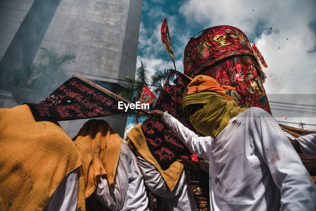 Low angle view of man wearing traditional clothing during celebration