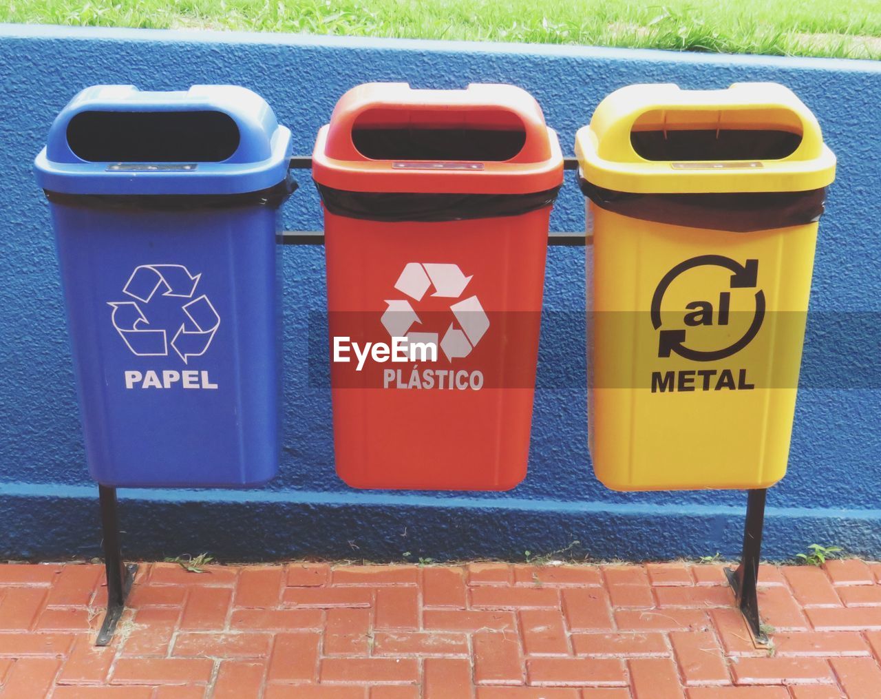 Colorful garbage bins on footpath