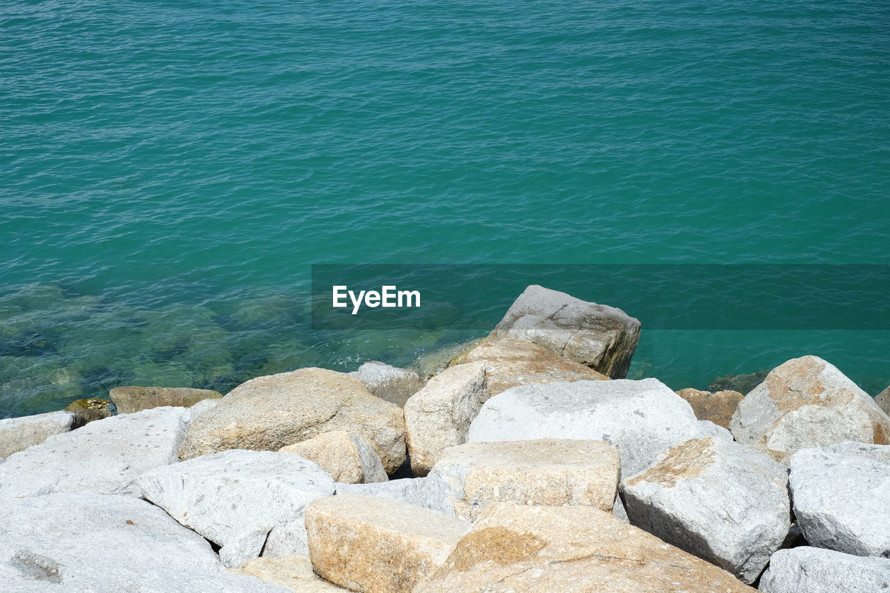 water, sea, rock, shore, nature, beauty in nature, day, high angle view, tranquility, no people, ocean, coast, tranquil scene, beach, scenics - nature, land, outdoors, terrain, sunlight